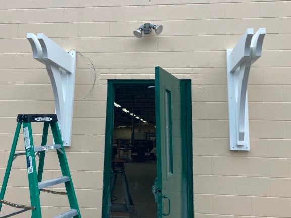 fiberglass awning braces on building